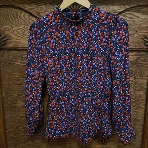 Orange, purple, navy peplum top